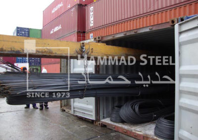 Heavey Crane Loading the Steel Rebars Bundles in Container