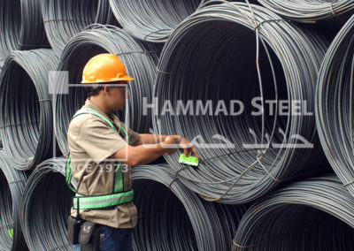 Inspector Checking the Quality of Steel Wire in Warehouse